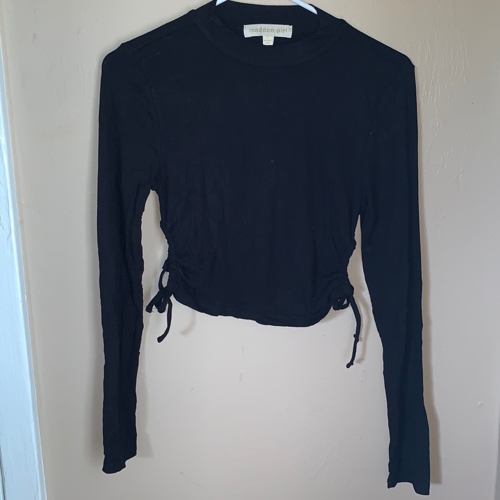Black top with holes on side